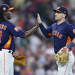
              Houston Astros relief pitcher Rafael Montero, left, high-fives third baseman Alex Bregman after a baseball game against the Tampa Bay Rays Sunday, Oct. 2, 2022, in Houston. (AP Photo/Kevin M. Cox)
            
