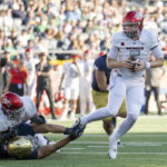 UNLV quarterback Harrison Bailey (5) evades tackle during the second half of an NCAA college football game against Notre Dame, Saturday, Oct. 22, 2022, in South Bend, Ind. (AP Photo/Marc Lebryk)