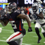 Atlanta Falcons running back Tyler Allgeier heads for the end zone during the second half of an NFL football game against the Carolina Panthers Sunday, Oct. 30, 2022, in Atlanta. (AP Photo/John Amis)