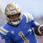 
              UCLA quarterback Dorian Thompson-Robinson (1) runs to the end zone for a touchdown during the first half of an NCAA college football game against Utah in Pasadena, Calif., Saturday, Oct. 8, 2022. (AP Photo/Ashley Landis)
            