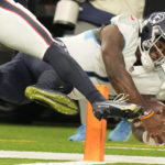Tennessee Titans quarterback Malik Willis is pushed out of bounds short of the goal line during the second half of an NFL football game against the Houston Texans Sunday, Oct. 30, 2022, in Houston. (AP Photo/Eric Christian Smith)