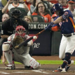 
              Houston Astros' Jose Altuve hits a double during the first inning in Game 2 of baseball's World Series between the Houston Astros and the Philadelphia Phillies on Saturday, Oct. 29, 2022, in Houston. (AP Photo/Sue Ogrocki)
            