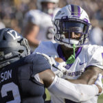 
              James Madison wide receiver Terrance Greene Jr. (0) hits Georgia Southern defensive back Anthony Wilson (12) after catching a pass during the first half of an NCAA football game, Saturday, Oct. 15, 2022, in Statesboro, Ga. (AP Photo/Stephen B. Morton)
            