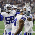 Dallas Cowboys defensive end Sam Williams (54) reacts after recovering a fumble by Detroit Lions quarterback Jared Goff during the second half of an NFL football game, Sunday, Oct. 23, 2022, in Arlington, Texas. (AP Photo/Ron Jenkins)