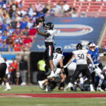 Cincinnati tight end Leonard Taylor (11) catches a pass during the first half of an NCAA college football game against SMU, Saturday, Oct. 22, 2022, in Dallas. (AP Photo/Brandon Wade)