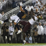 
              Penn State wide receiver Parker Washington (3) catches a 35-yard touchdown pass as Minnesota defensive back Terell Smith (4) defends during the second half of an NCAA college football game Saturday, Oct. 22, 2022, in State College, Pa. (AP Photo/Barry Reeger)
            