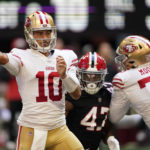 San Francisco 49ers quarterback Jimmy Garoppolo (10) works in the pocket against the Atlanta Falcons during the first half of an NFL football game, Sunday, Oct. 16, 2022, in Atlanta. (AP Photo/Brynn Anderson)