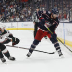 Columbus Blue Jackets' Boone Jenner, right, controls the puck as Arizona Coyotes' Troy Stecher defends during the second period of an NHL hockey game Tuesday, Oct. 25, 2022, in Columbus, Ohio. (AP Photo/Jay LaPrete)