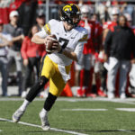 Iowa quarterback Spencer Petras drops back to pass against Ohio State during the first half of an NCAA college football game Saturday, Oct. 22, 2022, in Columbus, Ohio. (AP Photo/Jay LaPrete)