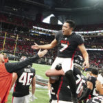 Atlanta Falcons place kicker Younghoe Koo (7) is congratulated by teammates after kicking a field goal overtime of an NFL football game to defeat the Carolina Panthers 37-34 Sunday, Oct. 30, 2022, in Atlanta. (AP Photo/John Bazemore)