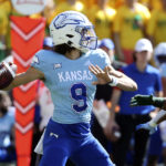 
              Kansas quarterback Jason Bean looks to pass against Baylor in the first half of an NCAA college football game, Saturday, Oct. 22, 2022, in Waco, Texas. (AP Photo/Jerry Larson)
            