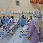 
              Survivors of Saturday's soccer riots are treated at a hospital in Malang, East Java, Indonesia, Monday Oct. 3, 2022. Police firing tear gas at Saturday night's match between host Arema FC of East Java's Malang city and Persebaya Surabaya in an attempt to stop violence triggered a disastrous crush of fans making a panicked, chaotic run for the exits, leaving a large number of people dead, most of them trampled upon or suffocated. (AP Photo/Achmad Ibrahim)
            