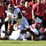 
              Alabama running back Jahmyr Gibbs (1) carries against Arkansas during the first half of an NCAA college football game Saturday, Oct. 1, 2022, in Fayetteville, Ark. (AP Photo/Michael Woods)
            