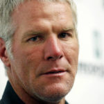 
              FILE - Former NFL quarterback Brett Favre speaks with reporters prior to his induction to the Mississippi Hall of Fame in Jackson, Miss., Saturday, Aug. 1, 2015. Mississippi's largest public corruption case in state history, in which tens of millions of dollars earmarked for needy families was misspent, involves a number of sports figures with ties to the state — including NFL royalty Brett Favre and a famous former pro wrestler. (AP Photo/Rogelio V. Solis, File)
            