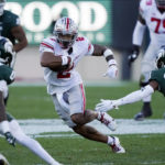 Ohio State wide receiver Emeka Egbuka (2) carries the ball during the first half of the team's NCAA college football game against Michigan State, Saturday, Oct. 8, 2022, in East Lansing, Mich. (AP Photo/Carlos Osorio)