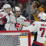 Washington Capitals' Aliaksei Protas (59) celebrates with Dylan Strome (17) and Conor Sheary (73) after Protas scored a goal against the Nashville Predators in the third period of an NHL hockey game Saturday, Oct. 29, 2022, in Nashville, Tenn. (AP Photo/Mark Humphrey)