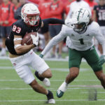 
              Houston wide receiver Peyton Sawyer (83) makes a gain in front of South Florida safety Matthew Hill (1) during the first half of an NCAA college football game Saturday, Oct. 29, 2022, in Houston. (AP Photo/Michael Wyke)
            