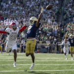 
              Notre Dame wide receiver Tobias Merriweather (15) misses a pass in front of UNLV defensive back Jordyn Morgan (25) during the second quarter of an NCAA college football game, Saturday, Oct. 22, 2022, in South Bend, Ind. (AP Photo/Marc Lebryk)
            