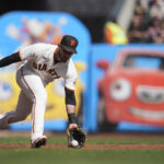 San Francisco Giants third baseman David Villar fields a ground ball hit by Arizona Diamondbacks' Christian Walker before throwing to second to force out Jordan Luplow during the first inning of a baseball game in San Francisco, Saturday, Oct. 1, 2022. (AP Photo/Godofredo A. Vásquez)