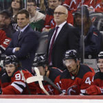 New Jersey Devils head coach Lindy Ruff looks on in the third period of an NHL hockey game against the Detroit Red Wings Saturday, Oct. 15, 2022, in Newark, N.J. The Red Wings won 5-2. (AP Photo/Adam Hunger)