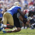 
              Utah tight end Dalton Kincaid (86) is tackled by UCLA defensive back Mo Osling III (7) during the first half of an NCAA college football game in Pasadena, Calif., Saturday, Oct. 8, 2022. (AP Photo/Ashley Landis)
            