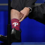 
              President Joe Biden shows off his Philadelphia Phillies socks as he speaks during the Pennsylvania Democratic Party's 3rd Annual Independence Dinner in Philadelphia, Friday, Oct. 28, 2022. (AP Photo/Matt Rourke)
            
