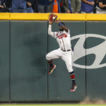 Atlanta Braves center fielder Michael Harris II makes a catch at the wall on a ball hit by New York Mets' Brandon Nimmo during the third inning of a baseball game Saturday, Oct. 1, 2022, in Atlanta. (AP Photo/Brett Davis)