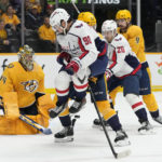 
              Washington Capitals' Marcus Johansson (90) jumps out of the way of a shot against Nashville Predators goaltender Juuse Saros (74) in the first period of an NHL hockey game Saturday, Oct. 29, 2022, in Nashville, Tenn. (AP Photo/Mark Humphrey)
            