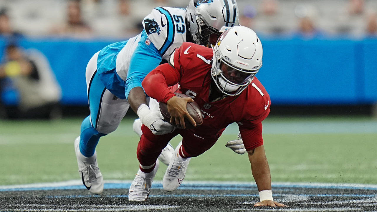 Arizona Cardinals quarterback Kyler Murray is tackled by Carolina Panthers defensive end Brian Burn...
