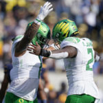 
              Oregon linebacker Noah Sewell (1) congratulates linebacker DJ Johnson (2) after Johnson's sack against California during the first half of an NCAA college football game in Berkeley, Calif., Saturday, Oct. 29, 2022. (AP Photo/Godofredo A. Vásquez)
            