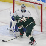 
              Minnesota Wild right wing Ryan Hartman (38) scores a goal on Vancouver Canucks goaltender Thatcher Demko (35) during the first period of an NHL hockey game Thursday, Oct. 20, 2022, in St. Paul, Minn. (AP Photo/Andy Clayton-King)
            