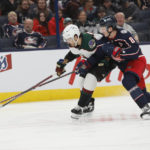 Arizona Coyotes' Jack McBain, left, and Columbus Blue Jackets' Zach Werenski chase a loose puck during the third period of an NHL hockey game Tuesday, Oct. 25, 2022, in Columbus, Ohio. (AP Photo/Jay LaPrete)