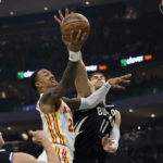 
              Atlanta Hawks forward John Collins (20) drives to the basket against Milwaukee Bucks' Brook Lopez during the first half of an NBA basketball game, Saturday, Oct. 29, 2022, in Milwaukee. (AP Photo/Jeffrey Phelps)
            