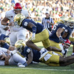 UNLV quarterback Harrison Bailey (5) is tackled during the second half of an NCAA college football game against Notre Dame, Saturday, Oct. 22, 2022, in South Bend, Ind. (AP Photo/Marc Lebryk)