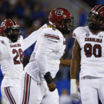 
              South Carolina defensive lineman Zacch Pickens (6), defensive lineman T.J. Sanders (90) and defensive back Darius Rush (28) celebrate after a block of a Kentucky punt during the first half of an NCAA college football game in Lexington, Ky., Saturday, Oct. 8, 2022. (AP Photo/Michael Clubb)
            