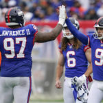 
              New York Giants place kicker Graham Gano (9) is congratulated by New York Giants defensive tackle Dexter Lawrence (97) after kicking a field goal Chicago Bears during the third quarter of an NFL football game, Sunday, Oct. 2, 2022, in East Rutherford, N.J. (AP Photo/Seth Wenig)
            