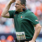 
              Miami head coach Mario Cristobal reacts after a play during the first half of an NCAA college football game against North Carolina, Saturday, Oct. 8, 2022, in Miami Gardens, Fla. (AP Photo/Wilfredo Lee)
            