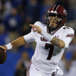 South Carolina quarterback Spencer Rattler looks for an open receiver during the first half of the team's NCAA college football game against Kentucky in Lexington, Ky., Saturday, Oct. 8, 2022. (AP Photo/Michael Clubb)