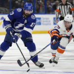 
              Tampa Bay Lightning left wing Alex Killorn (17) keeps the puck from New York Islanders center Brock Nelson (29) during the second period of an NHL hockey game Saturday, Oct. 22, 2022, in Tampa, Fla. (AP Photo/Chris O'Meara)
            
