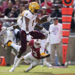Arizona State running back Xazavian Valladay (1) scores a touchdown past Stanford cornerback Ethan Bonner (13) during the first half an NCAA college football game in Stanford, Calif., Saturday, Oct. 22, 2022. (AP Photo/Jeff Chiu)