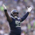 Seattle Seahawks defensive end Shelby Harris (93) gestures toward fans during the second half of an NFL football game against the Arizona Cardinals in Seattle, Sunday, Oct. 16, 2022. (AP Photo/Abbie Parr)