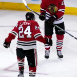 
              Chicago Blackhawks center Jason Dickinson, right, celebrates with center Sam Lafferty after scoring his goal during the third period of an NHL hockey game against the Seattle Kraken in Chicago, Sunday, Oct. 23, 2022. (AP Photo/Nam Y. Huh)
            