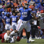 
              Florida quarterback Anthony Richardson (15) throws a pass for a completion while under pressure from Eastern Washington defensive lineman Brock Harrison during the first half of an NCAA college football game, Sunday, Oct. 2, 2022, in Gainesville, Fla. (AP Photo/Phelan M. Ebenhack)
            