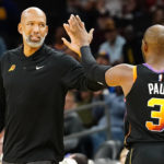 Phoenix Suns' head coach Monty Williams gives a high five to Chris Paul (3)  in the closing minutes of the second half of an NBA basketball game against the Houston Rockets in Phoenix. Phoenix won 124-109 over Houston. (AP Photo/Darryl Webb)