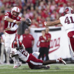 
              Nebraska quarterback Casey Thompson (11) passes the ball while still in the pocket as Indiana's Indiana defensive back Noah Pierre (21) dives in for the tackle during the first half of an NCAA college football game Saturday, Oct. 1, 2022, in Lincoln, Neb. Thompson was called for intentional grounding on the play. (AP Photo/Rebecca S. Gratz)
            