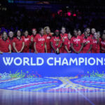 Gold medalists the United States pose for photo after defeating China in the final at the women's Basketball World Cup in Sydney, Australia, Saturday, Oct. 1, 2022. (AP Photo/Mark Baker)
