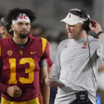 Southern California quarterback Caleb Williams, left, talks with head coach Lincoln Riley during the second half of an NCAA college football game against Arizona State Saturday, Oct. 1, 2022, in Los Angeles. (AP Photo/Mark J. Terrill)
