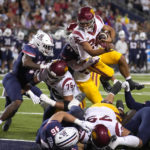 Southern California running back Travis Dye (26) scores a touchdown against Arizona in the second half during an NCAA college football game, Saturday, Oct. 29, 2022, in Tucson, Ariz. (AP Photo/Rick Scuteri)
