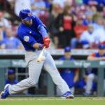 Chicago Cubs' David Bote hits a two-run double during the sixth inning of the team's baseball game against the Cincinnati Reds in Cincinnati, Wednesday, Oct. 5, 2022. (AP Photo/Aaron Doster)
