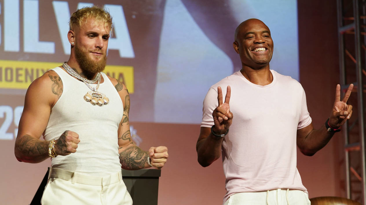 Jake Paul, left, and Anderson Silva pose for photos during a news conference Monday, Sept. 12, 2022...